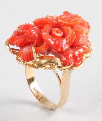 Appraisal: KY one x mm floral motif carved coral prong set