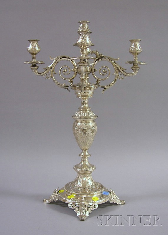 Appraisal: Neoclassical Silver Plated Five-Light Candelabra supported by scrolled and leaf