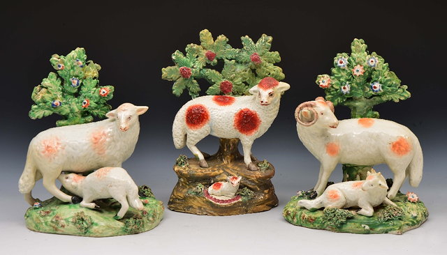 Appraisal: Near pair of Staffordshire sheepcirca each with a lamb against