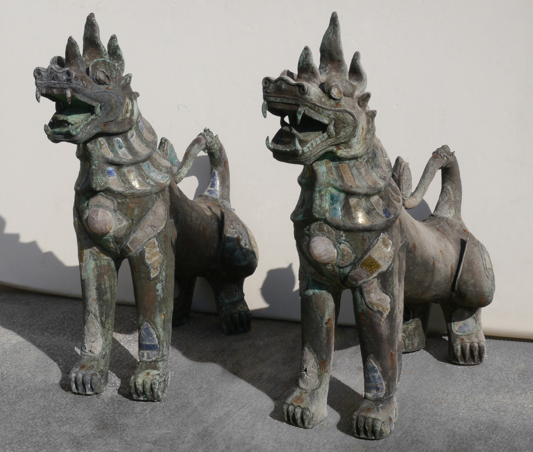 Appraisal: PAIR LARGE BRONZE TIBETAN TEMPLE DOGS Similar crouching pair each