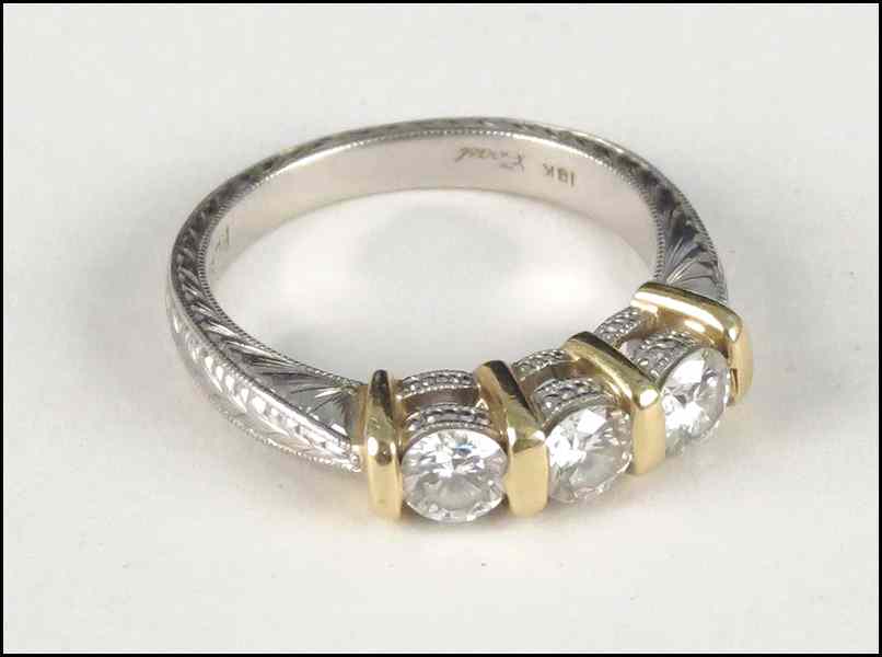 Appraisal: PLATINUM KARAT YELLOW GOLD AND DIAMOND RING Three diamonds are