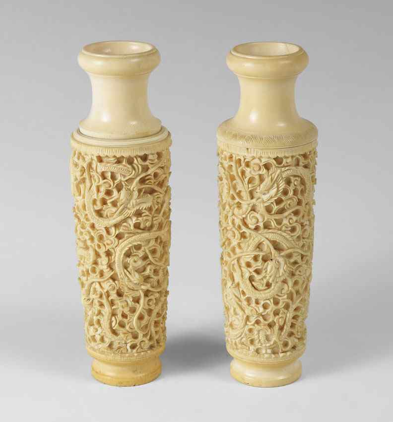 Appraisal: PAIR CHINESE CARVED IVORY VASES Each similar with slight differences