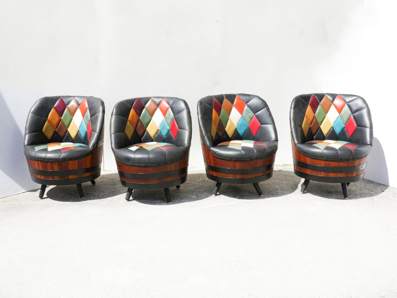 Appraisal: FOUR MID-CENTURY WHISKEY BARREL SWIVEL CHAIRS pc Matthew Brothers chairs