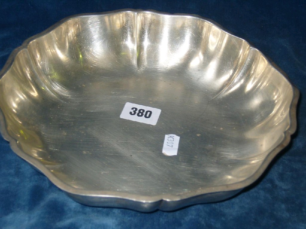 Appraisal: A continental white metal dish of shaped form back is