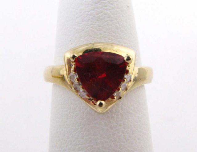 Appraisal: Ladies k Yellow Gold ring with trillion cut Red Andesine