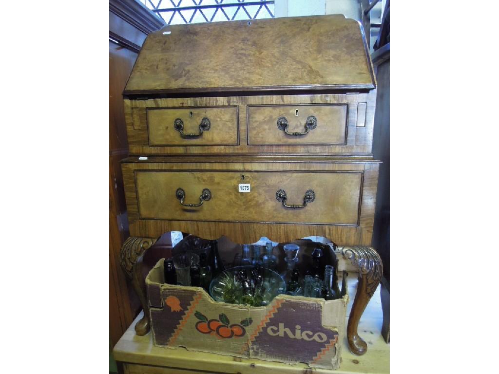 Appraisal: A Queen Anne style walnut and figured walnut veneered bureau