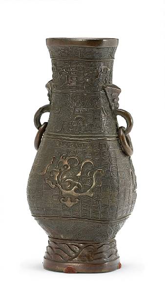 Appraisal: A cast bronze vase Yuan Ming Dynasty Of flattened hu