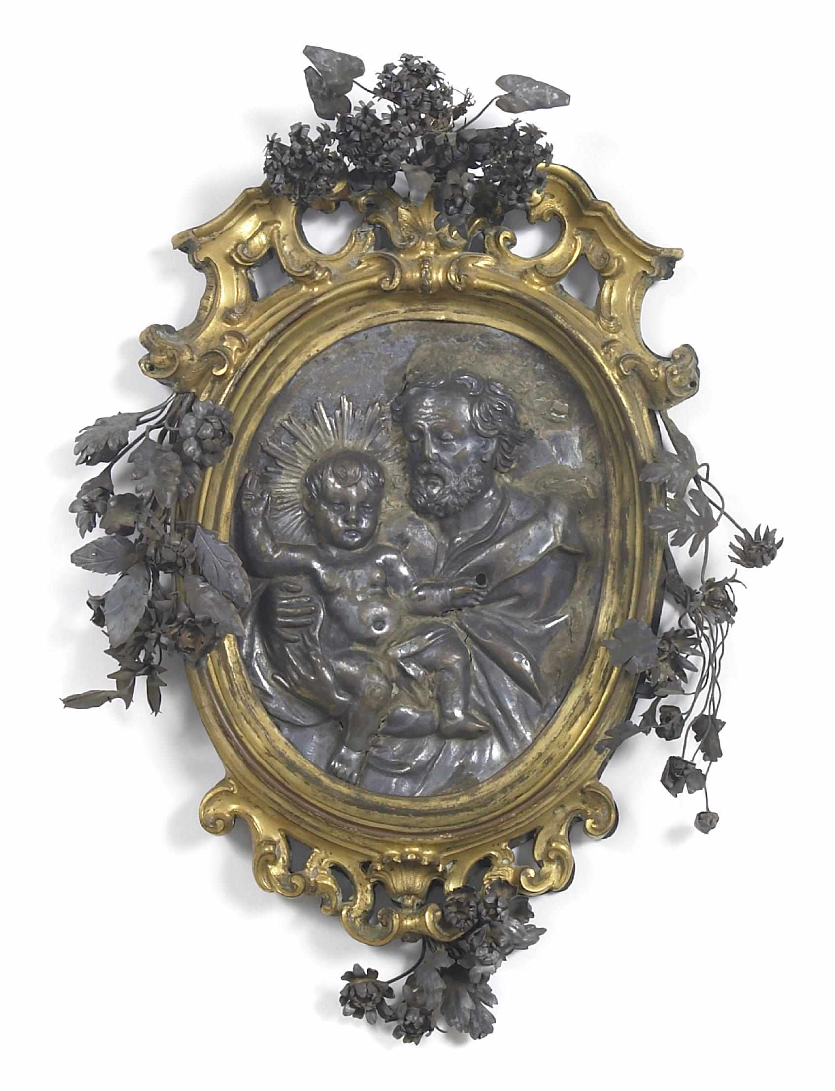 Appraisal: An Italian silvered metal oval panel depicting Joseph and the