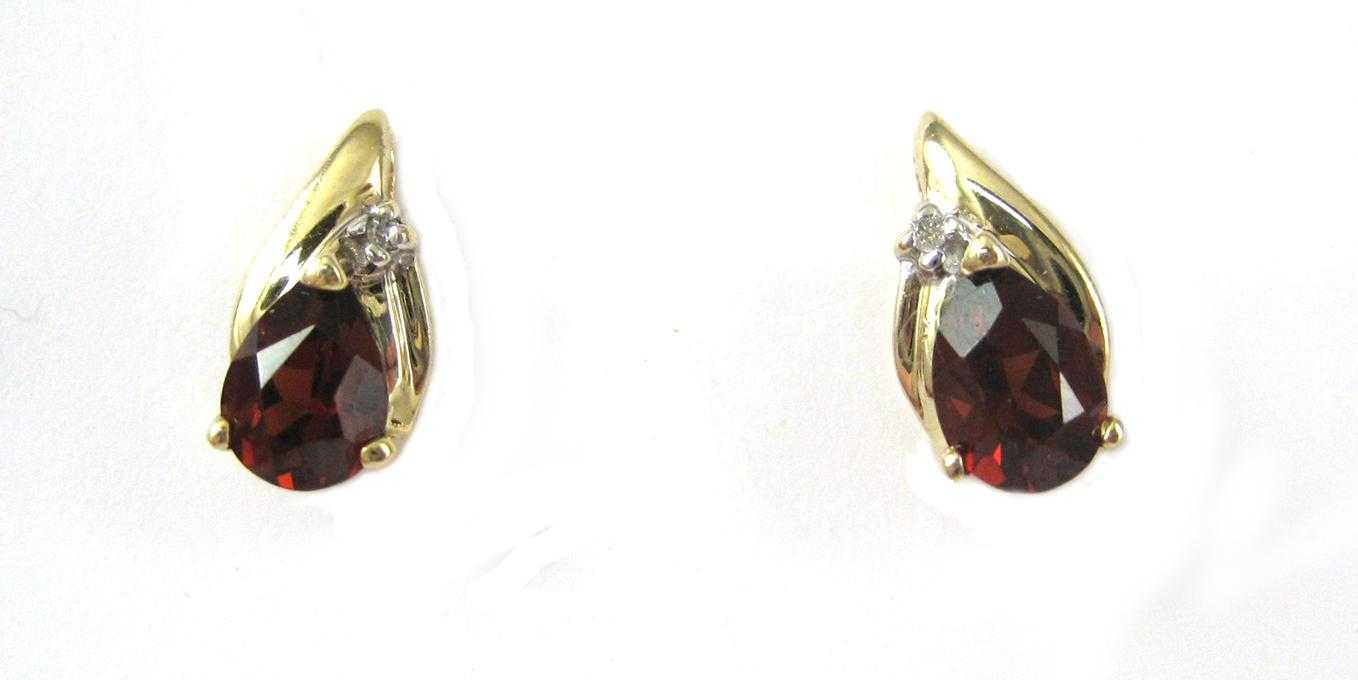 Appraisal: PAIR OF GARNET AND DIAMOND EARRINGS each k yellow gold