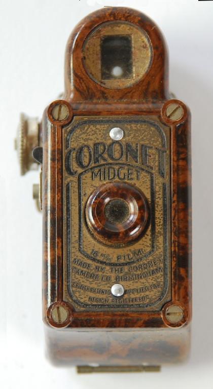 Appraisal: CORONET 'MIDGET' ROLL FILM CAMERA mm with mottled brown case