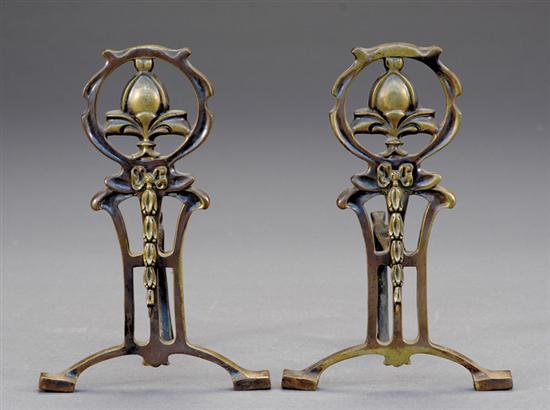 Appraisal: Arts Crafts wrought-metal andirons circa pierced upright with outscrolled feet