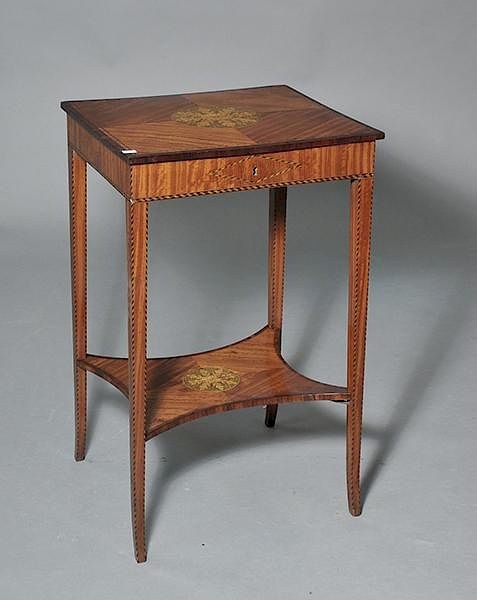 Appraisal: Delicate Edwardian satinwood sewing stand with oak leaf motifs Delicate