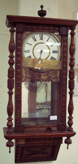 Appraisal: An American wall clock in a walnut case fitted a