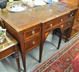 Appraisal: A th century crossbanded mahogany breakfront sideboard the centre frieze