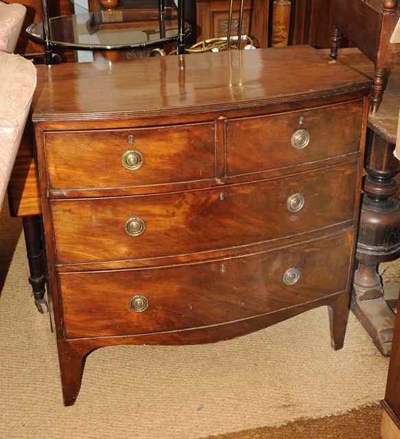 Appraisal: A SMALL SIZED GEORGIAN MAHOGANY BOW FRONTED CHEST of two