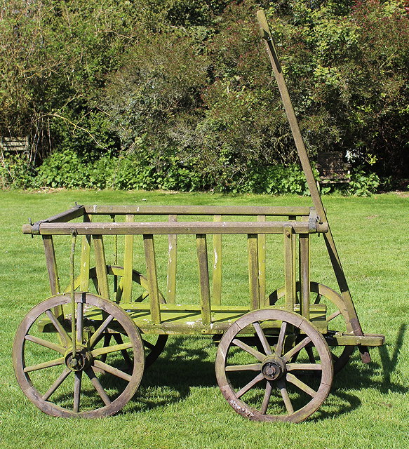 Appraisal: A SMALL HAND CART with slatted sides and four spoked