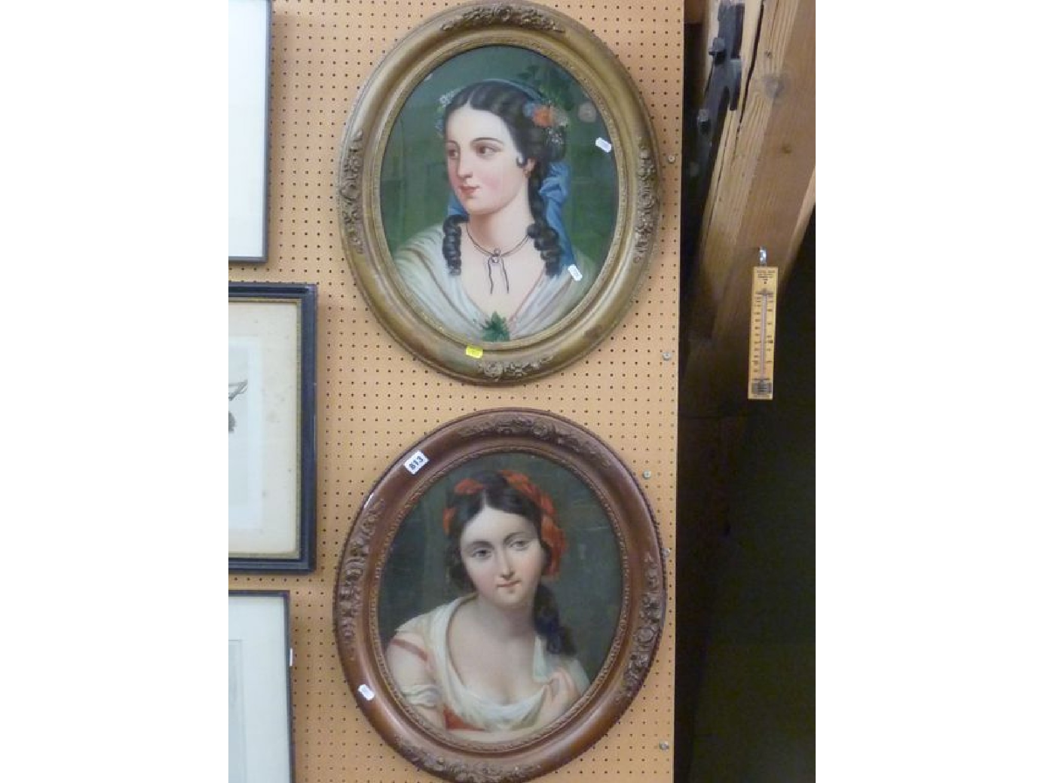 Appraisal: A pair of th century oil paintings on oval convex