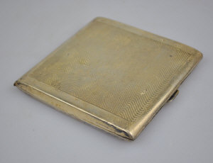 Appraisal: A silver gilt cigarette case with machine turning Birmingham oz