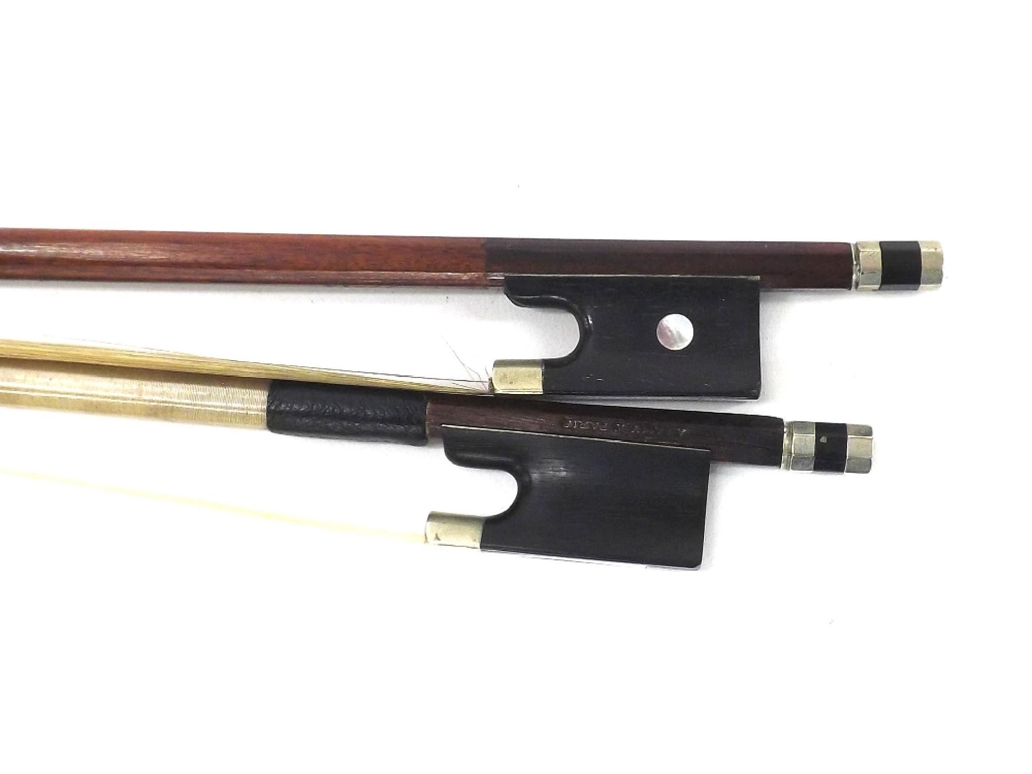 Appraisal: Nickel mounted violin bow stamped A Lamy Paris and another