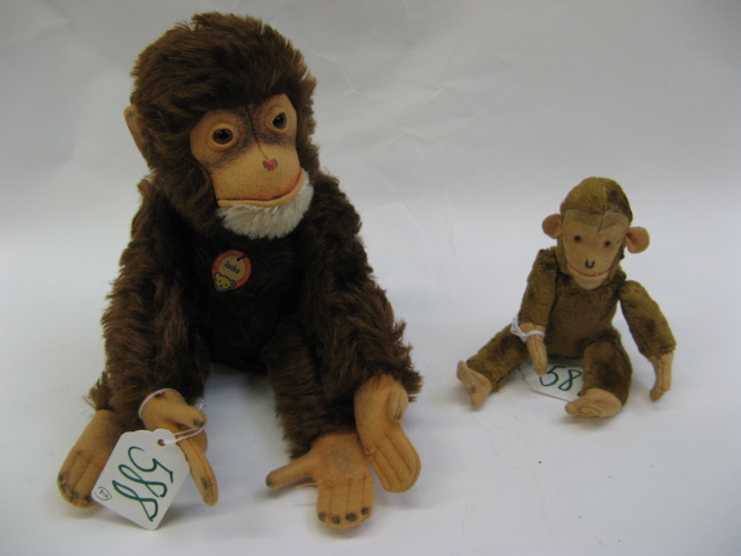 Appraisal: TWO GERMAN STEIFF MONKEYS The larger monkey with brown and