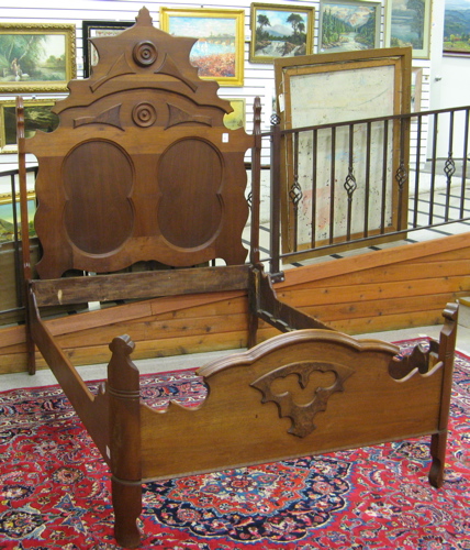 Appraisal: MID-VICTORIAN WALNUT BED WITH RAILS Rococo Revival design American c