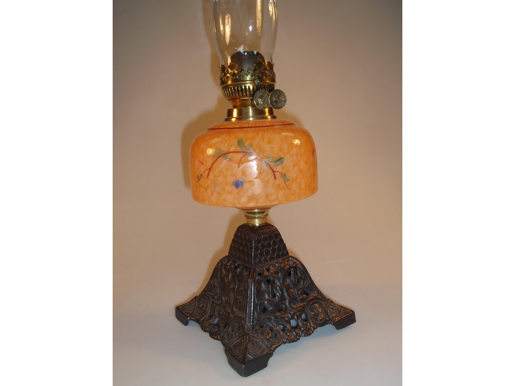 Appraisal: A late Victorian oil lamp with orange glass reservoir painted