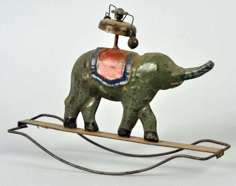 Appraisal: Early Tin Elephant Bell Toy American Elephant figure is on