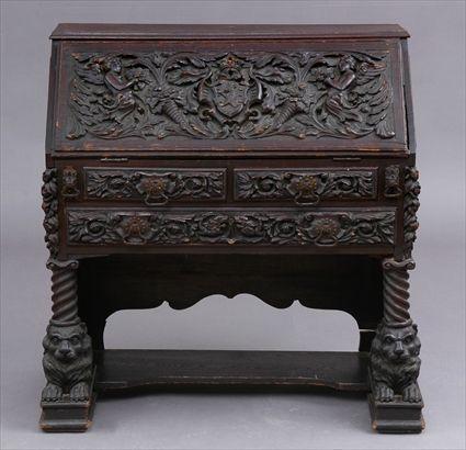 Appraisal: ITALIAN BAROQUE-STYLE CARVED OAK SLANT FRONT DESK The flap carved