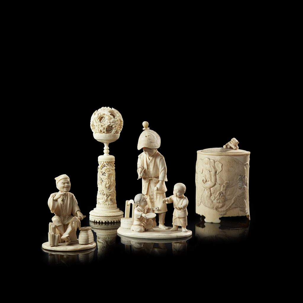 Appraisal: YTWO CARVED IVORY OKIMONO MEIJI PERIOD the first depicting a