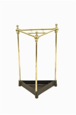 Appraisal: A late Victorian turned brass triangular stickstand with a cast