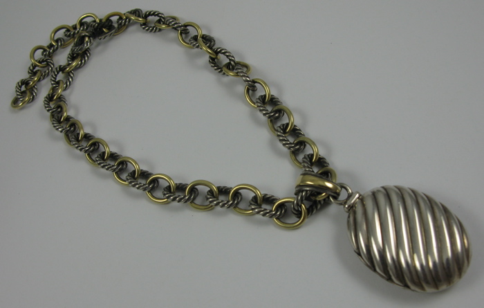 Appraisal: DAVID YURMAN LOCKET AND CHAIN sterling silver and K yellow