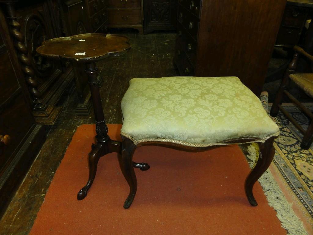 Appraisal: A Victorian rose wood stool of rectangular form with shaped