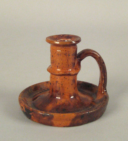 Appraisal: Rare Pennsylvania redware chamberstick th c with manganese splash decoration