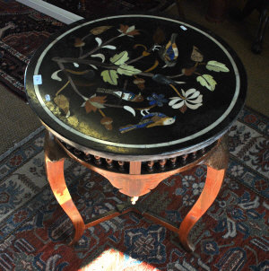 Appraisal: A circular specimen marble inlaid occasional table raised on a