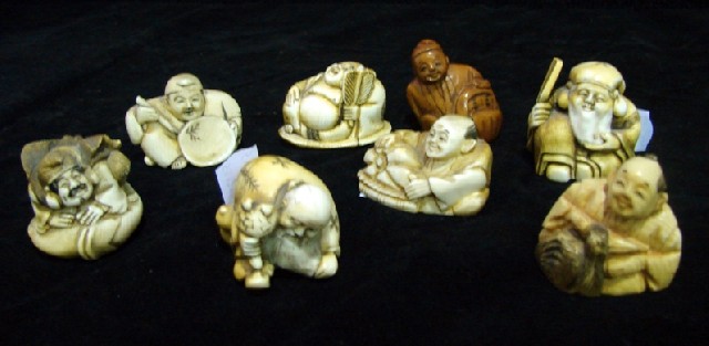 Appraisal: Eight various Japanese figural netsukes in carved ivory in stained