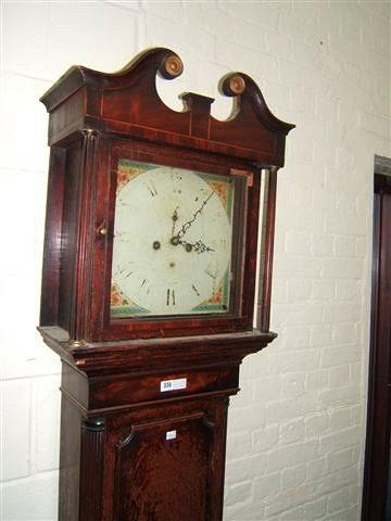 Appraisal: A Georgian oak eight day long case clock the hood