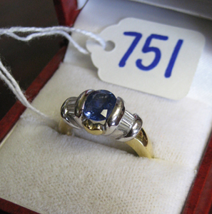 Appraisal: SAPPHIRE DIAMOND AND EIGHTEEN KARAT YELLOW AND WHITE GOLD RING