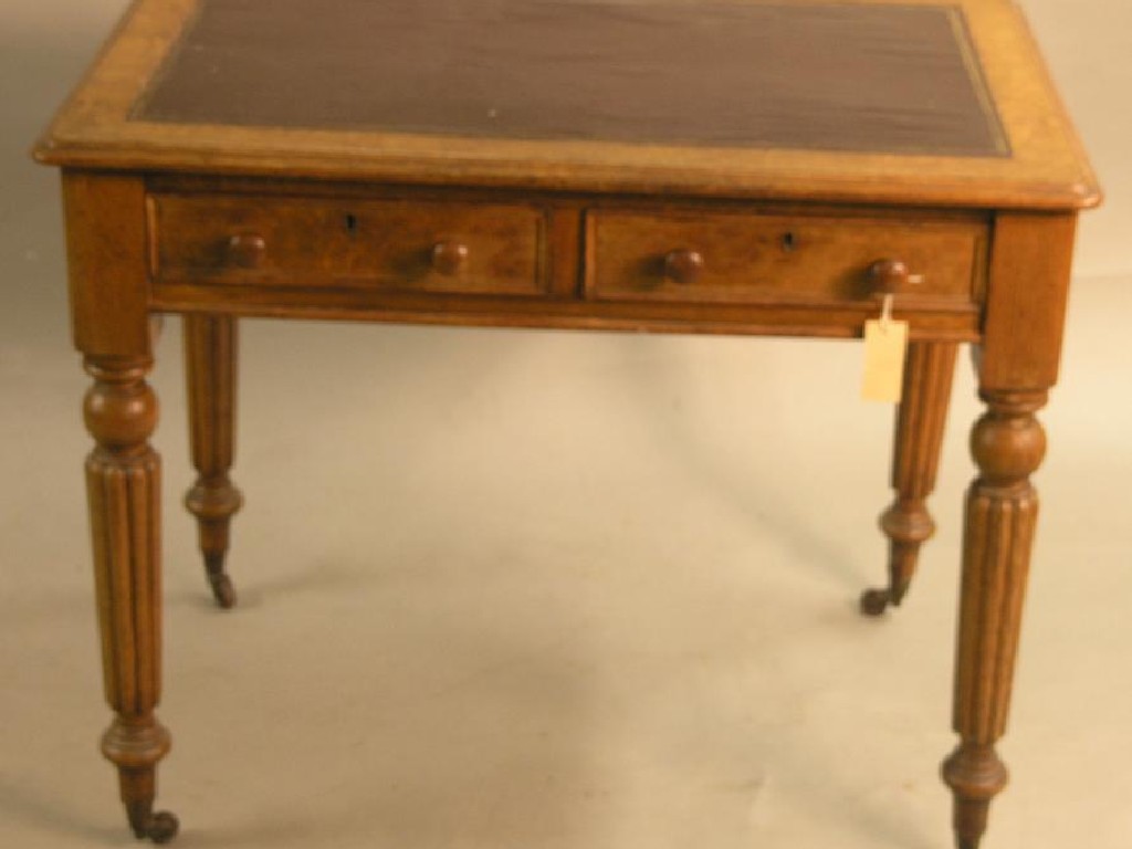 Appraisal: A Victorian oak writing table with inset leather top two