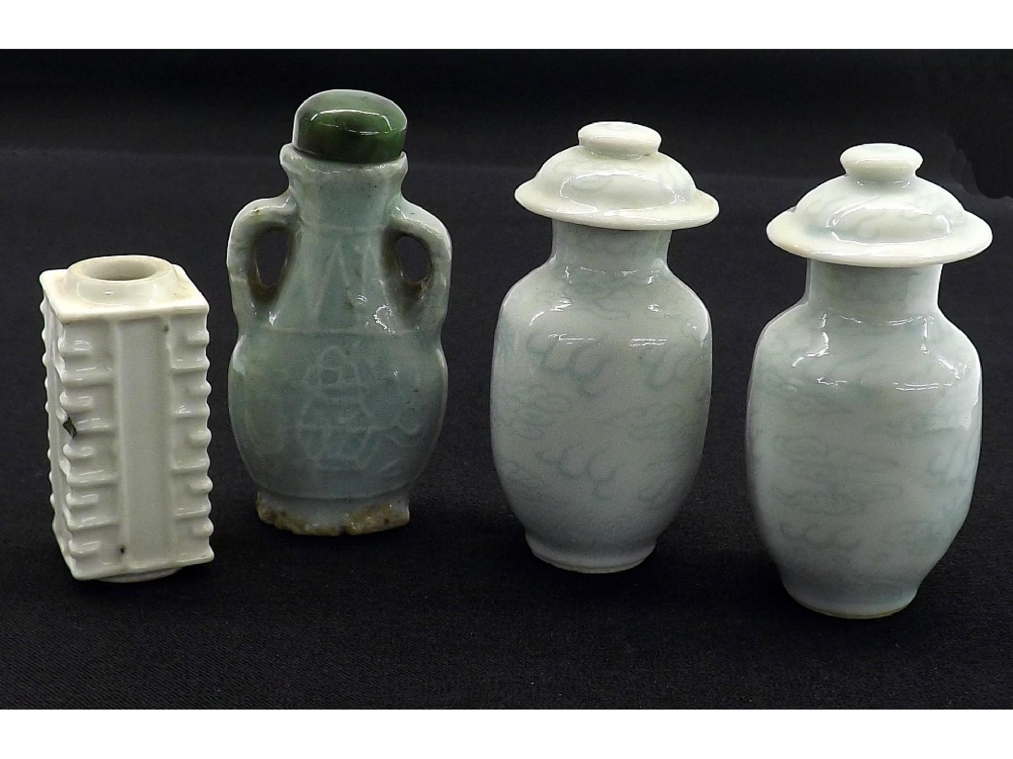 Appraisal: Pair of pale celadon vase shaped snuff bottles and covers