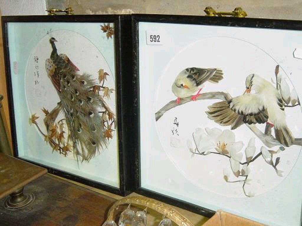 Appraisal: A pair of oriental relief pictures made with natural feathers