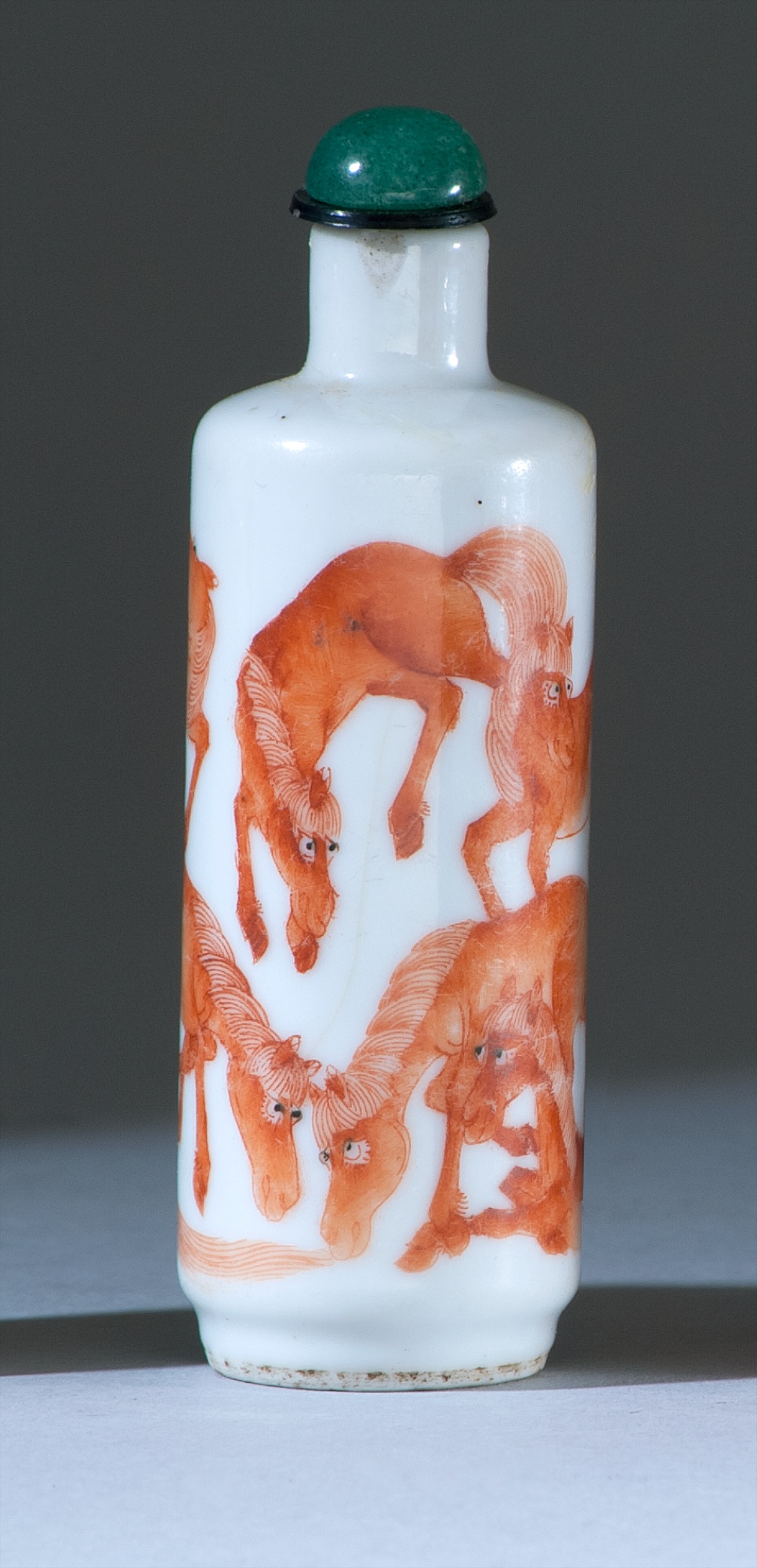 Appraisal: PORCELAIN SNUFF BOTTLE th CenturyIn cylinder form with coral-red depiction