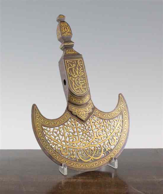 Appraisal: An Islamic steel and gilt decorated ceremonial axe head the