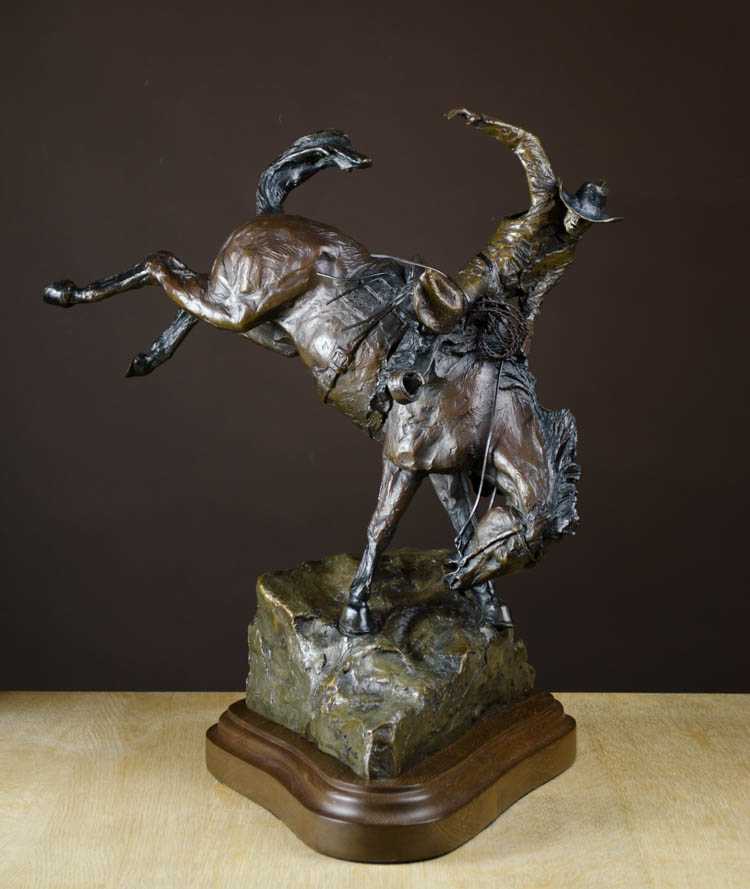 Appraisal: LORENZO GHIGLIERI BRONZE SCULPTURE Oregon born Cowboy on bucking bronco