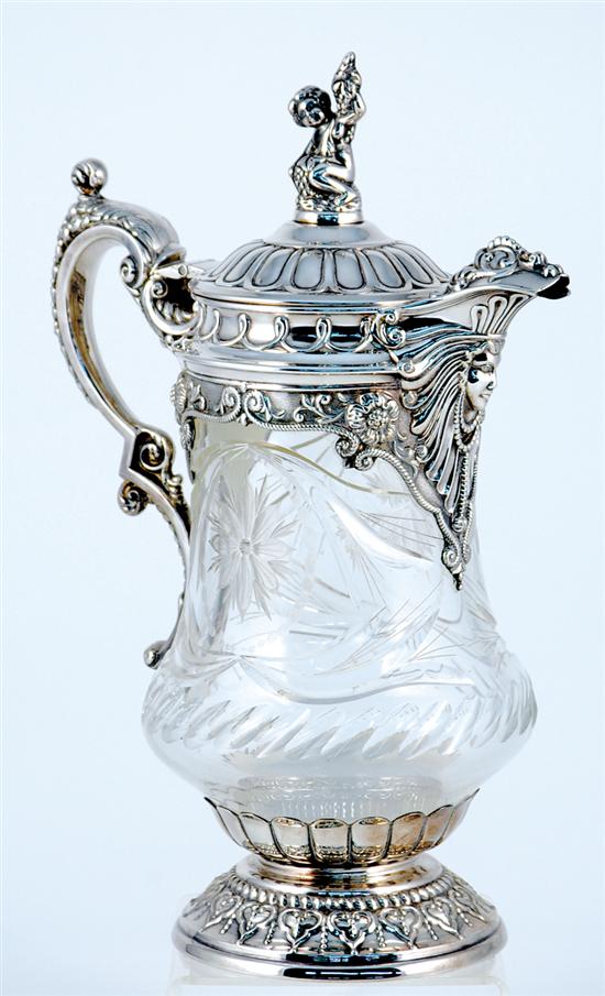 Appraisal: Continental silverplate mounted crystal pitcher figural finial on domed hinged