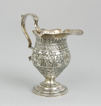 Appraisal: A British Miniature Silver Pitcher A miniature silver pitcher made