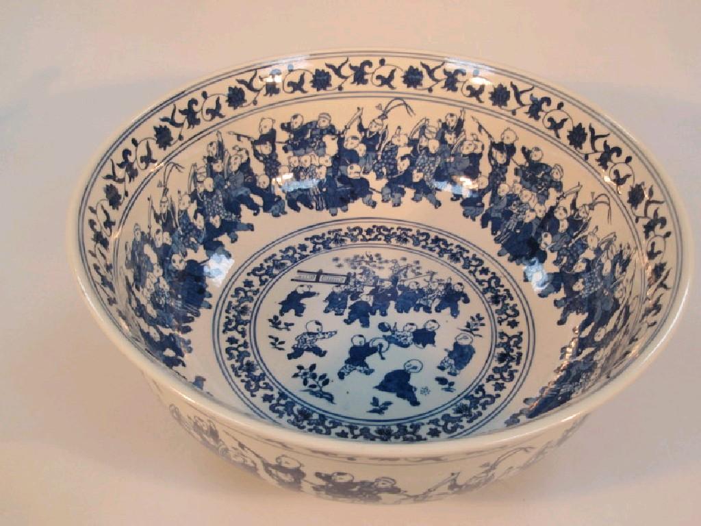 Appraisal: A thC Chinese blue and white punch with encircling bands