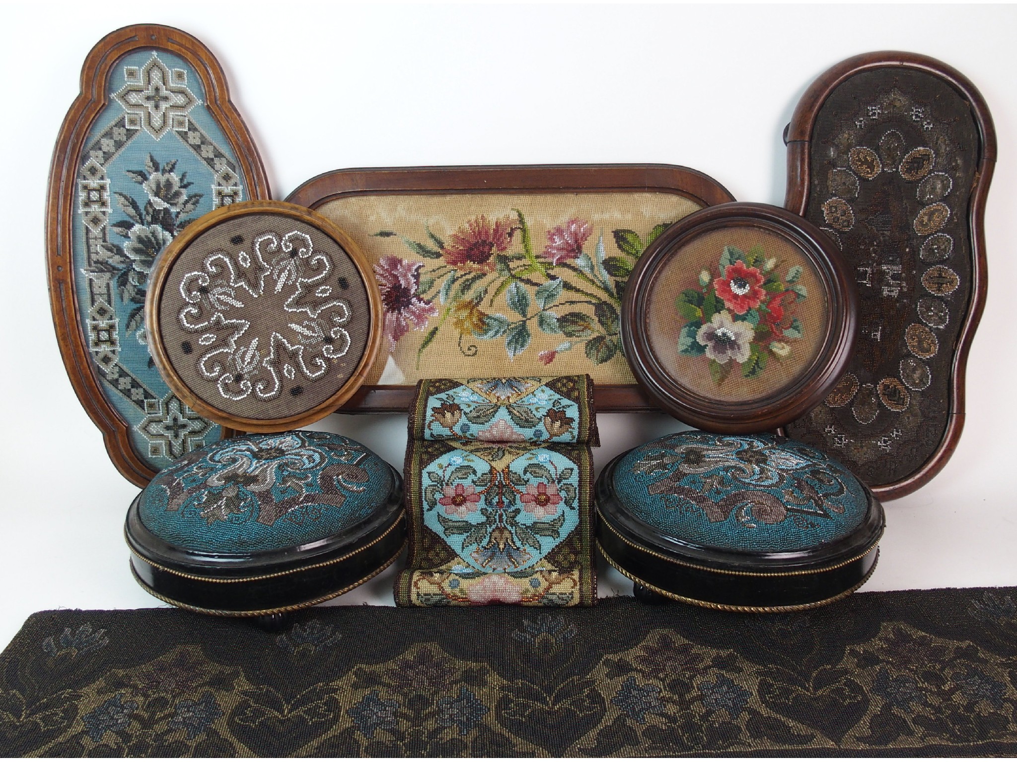 Appraisal: A group of Victorian beadworkcomprising two foot stools two circular