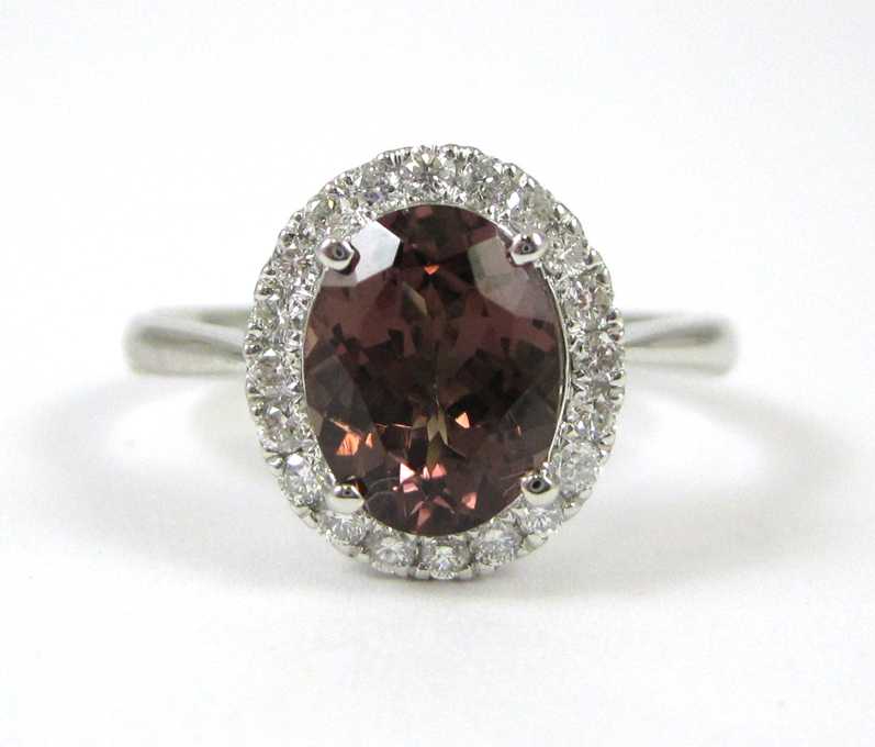 Appraisal: COLOR CHANGE GARNET AND DIAMOND RING k white gold with