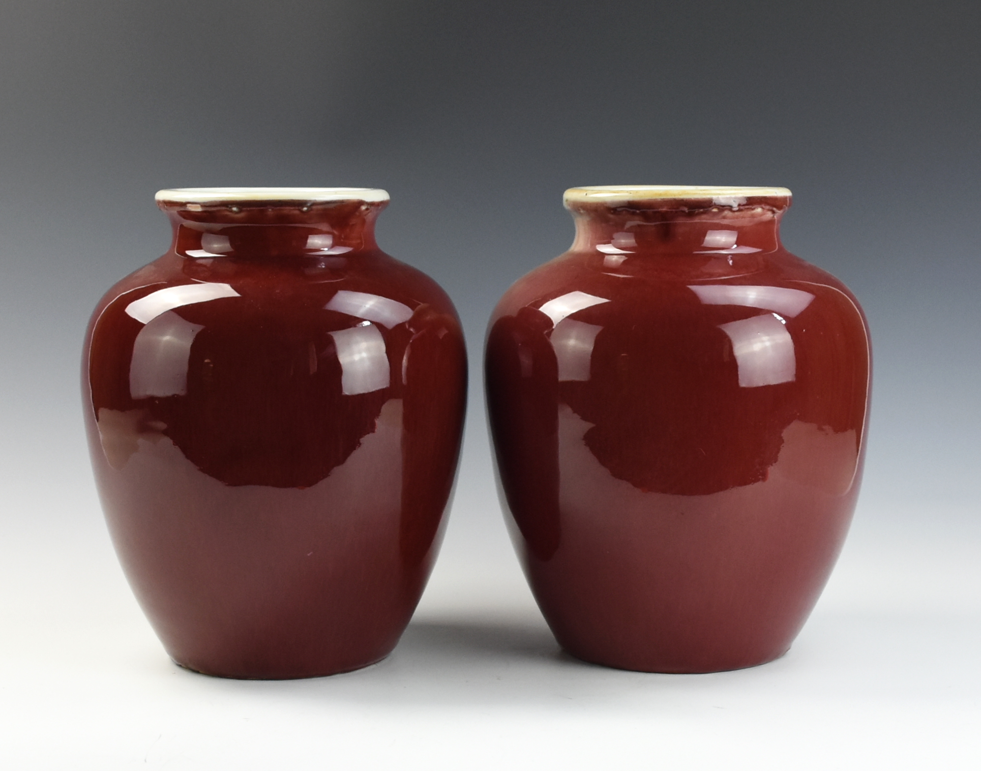 Appraisal: PAIR OF CHINESE COPPER-RED GLAZED JARS TH C of baluster