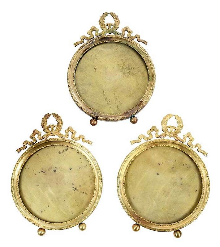 Appraisal: French Round Bronze Frames French th century Louis XVI style